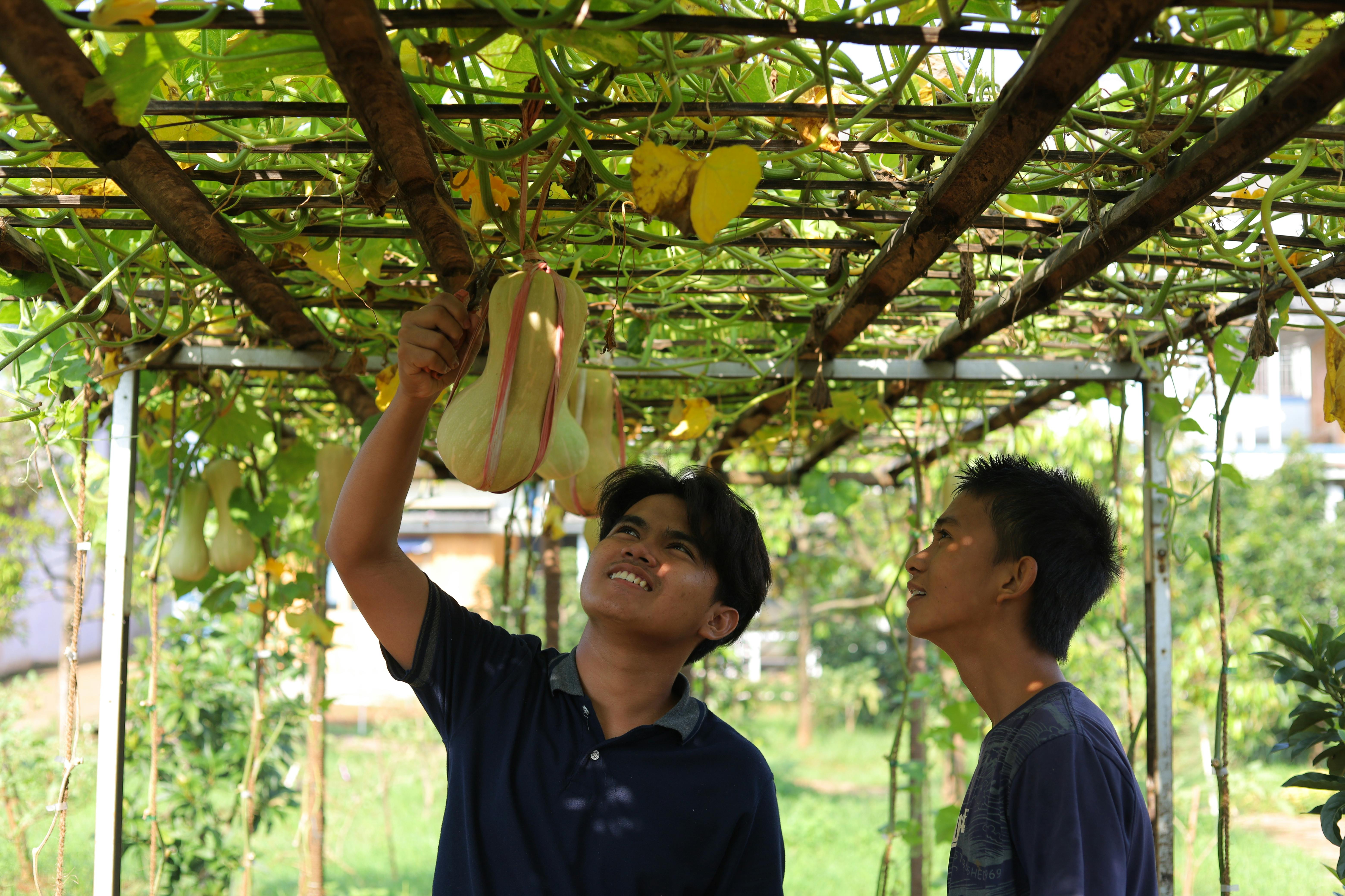 STEM coaches working with youth in a hands-on learning environment