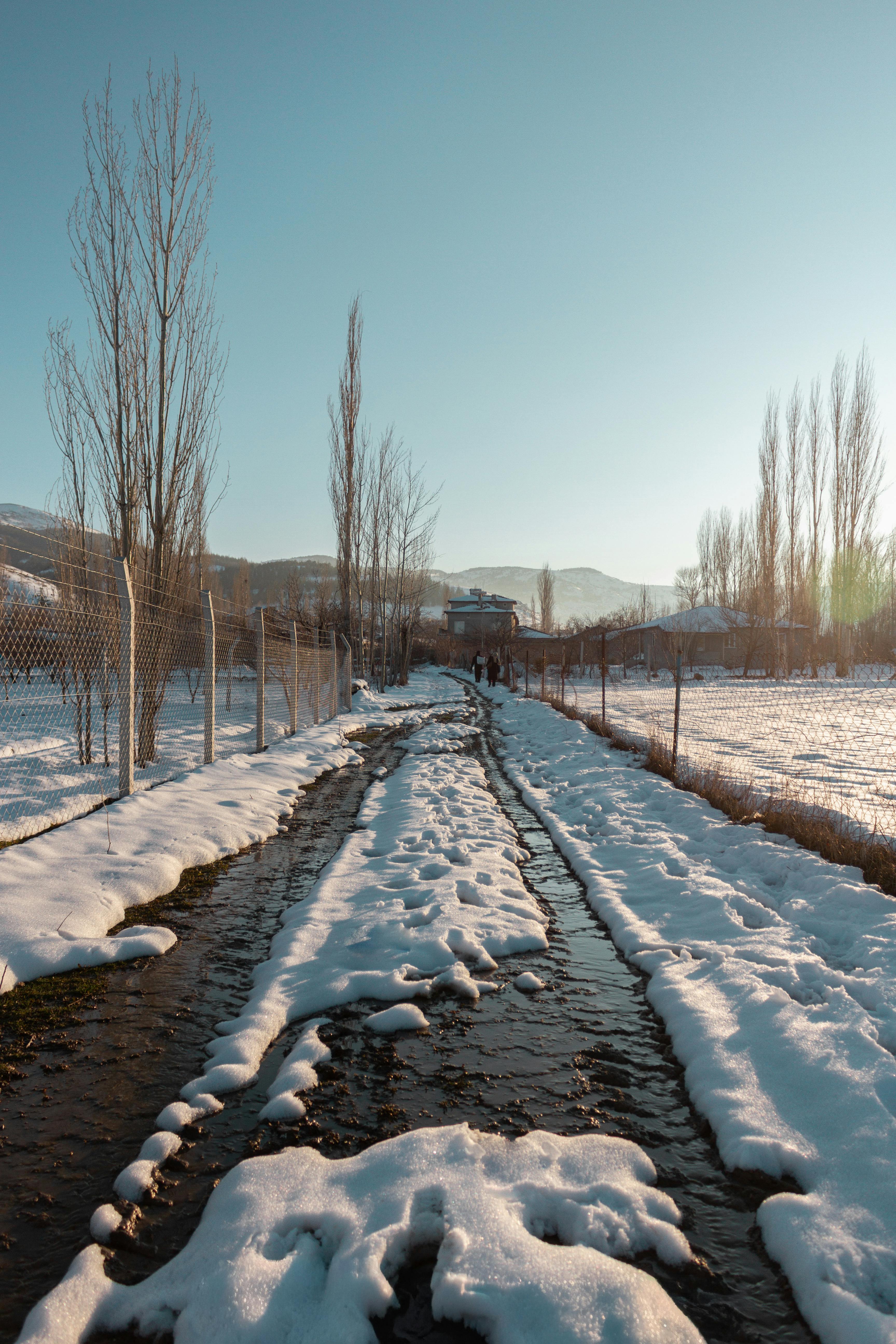 Winter path running through a farm field